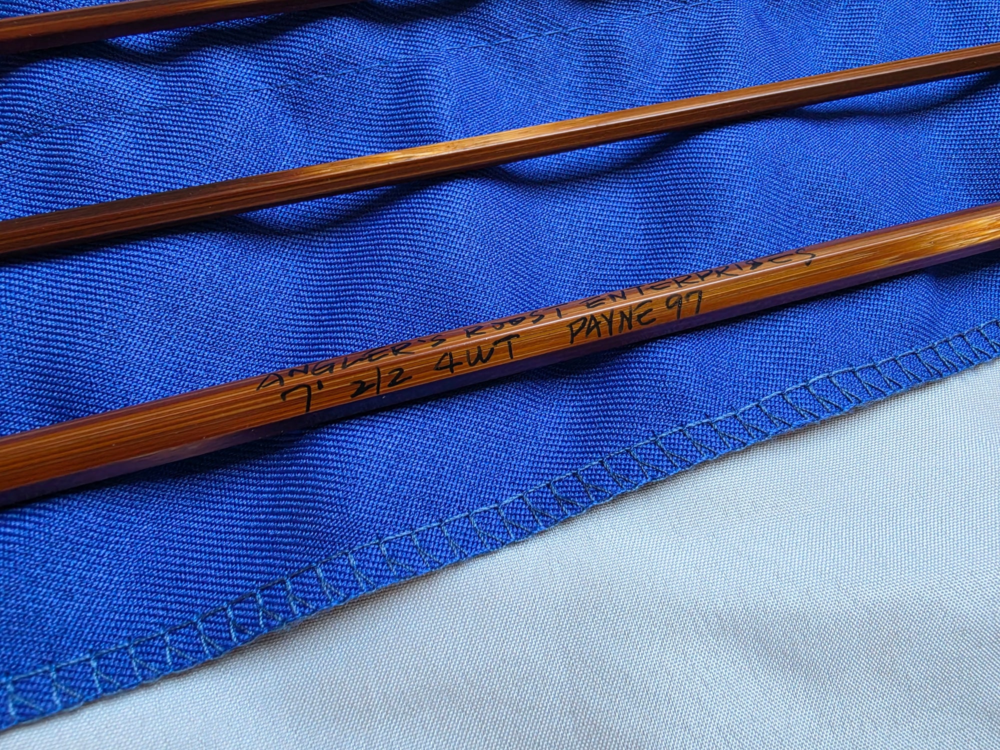 Flame-tempered Payne 97 bamboo rod blank tip sections in blue cloth bag, no ferrules installed