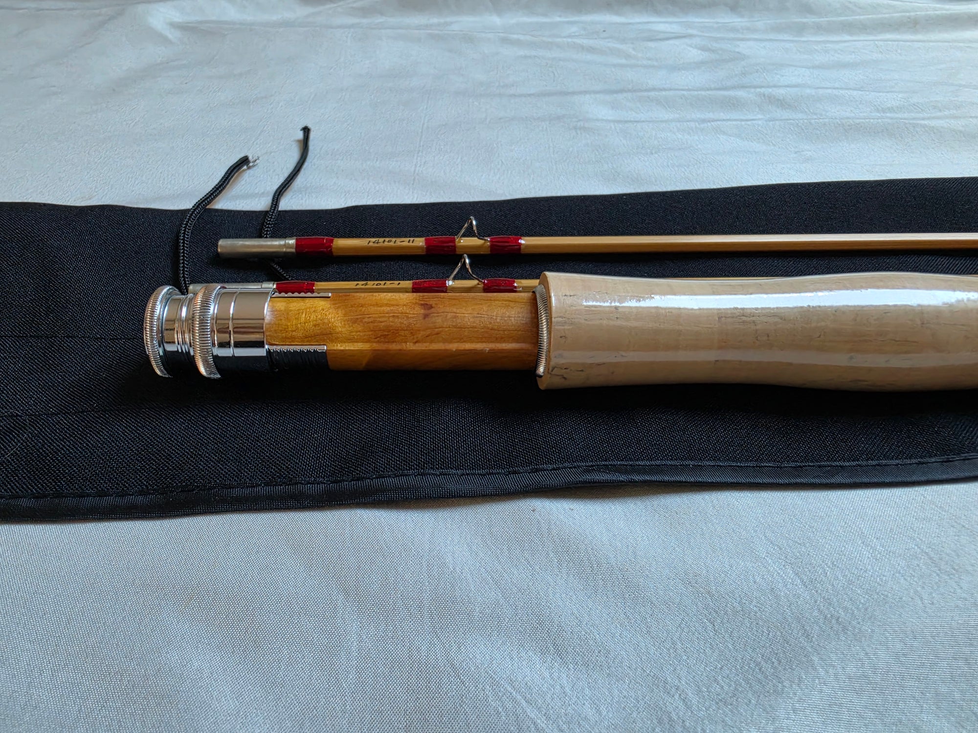 Cork grip, figured burl-wood reel seat, and nickel-silver downlocking hardware on Dickerson 7613 bamboo fly rod