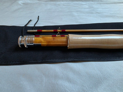 Cork grip, figured burl-wood reel seat, and nickel-silver downlocking hardware on Dickerson 7613 bamboo fly rod