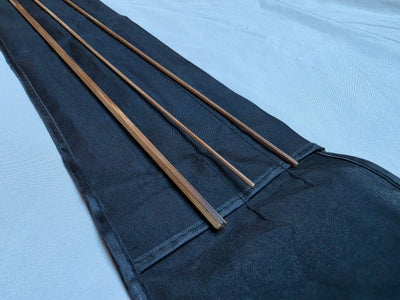Close-up of flame-tempered bare-cane Powell taper bamboo rod blank, no ferrules installed